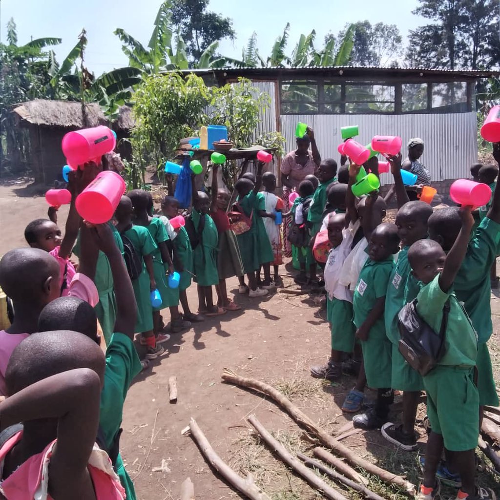 Children waiting to receive their porridge